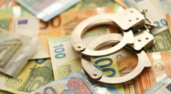 Many European euro money bills and handcuffs. Lot of banknotes of European union currency and cuffs close up,Image: 883489574, License: Royalty-free, Restrictions: , Model Release: no, Credit line: Mykhailo Polenok / Panthermedia / Profimedia