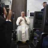 epa11602739 Pope Francis speaks during a news conference aboard the papal plane on his flight back after his 12-day journey across Southeast Asia and Oceania, 13 September 2024. Pope Francis visited Singapore from 11 to 13 September, marking the final stop of his apostolic journey through the Asia-Pacific region, which also included Indonesia, Papua New Guinea, and East Timor.  EPA/Guglielmo Mangiapane / POOL