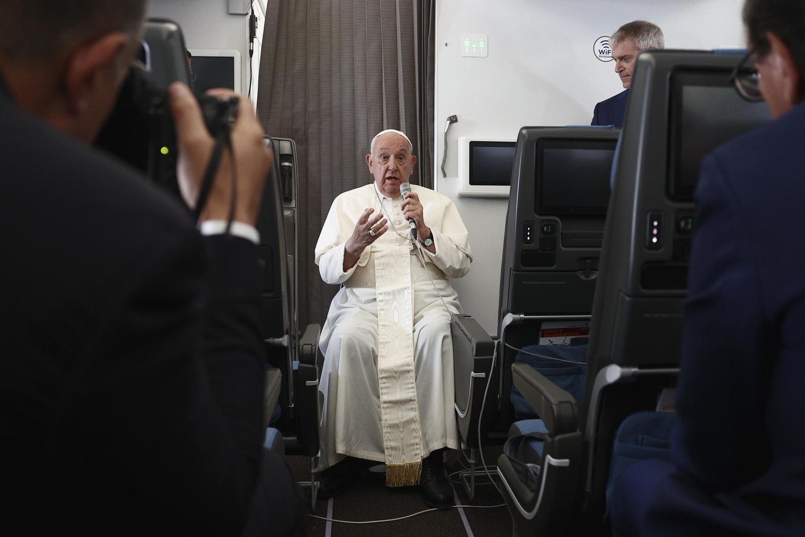 epa11602739 Pope Francis speaks during a news conference aboard the papal plane on his flight back after his 12-day journey across Southeast Asia and Oceania, 13 September 2024. Pope Francis visited Singapore from 11 to 13 September, marking the final stop of his apostolic journey through the Asia-Pacific region, which also included Indonesia, Papua New Guinea, and East Timor.  EPA/Guglielmo Mangiapane / POOL