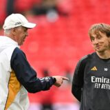 Real Madrid's Italian coach Carlo Ancelotti (L) speaks with Real Madrid's Croatian midfielder #10 Luka Modric as they take part in a training session at Wembley stadium, in London, on May 31, 2024 on the eve of their UEFA Champions League final football match against Borussia Dortmund.,Image: 877925089, License: Rights-managed, Restrictions: , Model Release: no, Credit line: Glyn KIRK / AFP / Profimedia