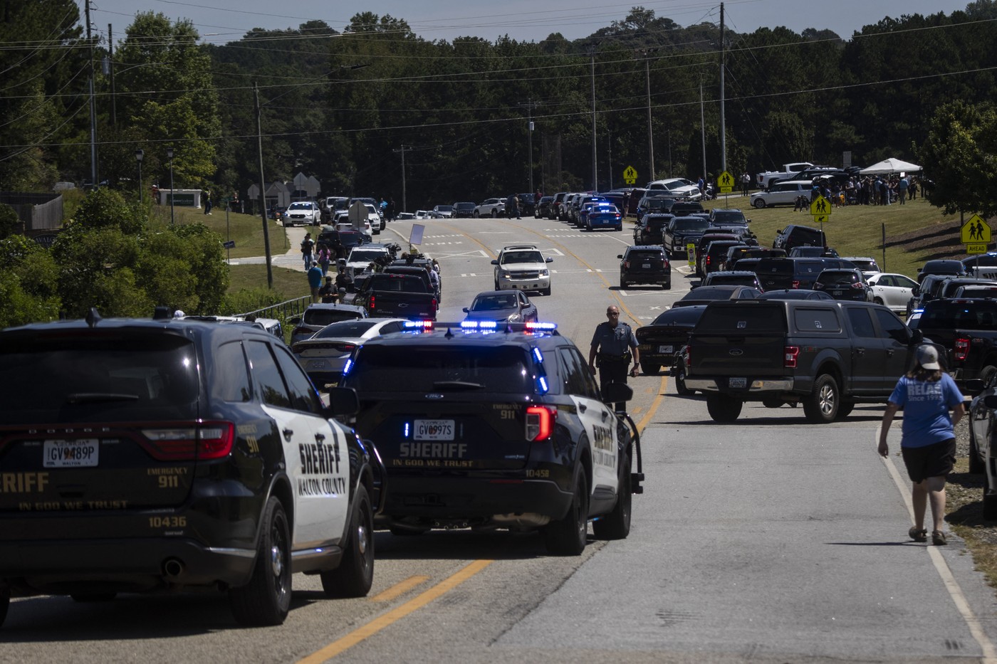 Law enforcement and first responders control traffic after a shooting took place at Apalachee High School in Winder, Georgia, on September 4, 2024. Four people were killed and nine wounded in the school shooting on Wednesday, the Georgia Bureau of Investigation said. "Four dead. An additional nine taken to various hospitals with injuries. Suspect in custody and alive. Reports that the suspect has been 'neutralized' are inaccurate," the bureau said in a social media post.,Image: 904756383, License: Rights-managed, Restrictions: , Model Release: no, Credit line: CHRISTIAN MONTERROSA / AFP / Profimedia