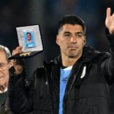 Uruguay's forward Luis Suarez waves next to Uruguay's former head coach Washington Tabarez after receiving a a commemorative plaque during his farewell ceremony to the national team after the 2026 FIFA World Cup South American qualifiers football match between Uruguay and Paraguay at the Centenario stadium in Montevideo, on September 6, 2024.,Image: 905441656, License: Rights-managed, Restrictions: , Model Release: no, Credit line: Eitan ABRAMOVICH / AFP / Profimedia