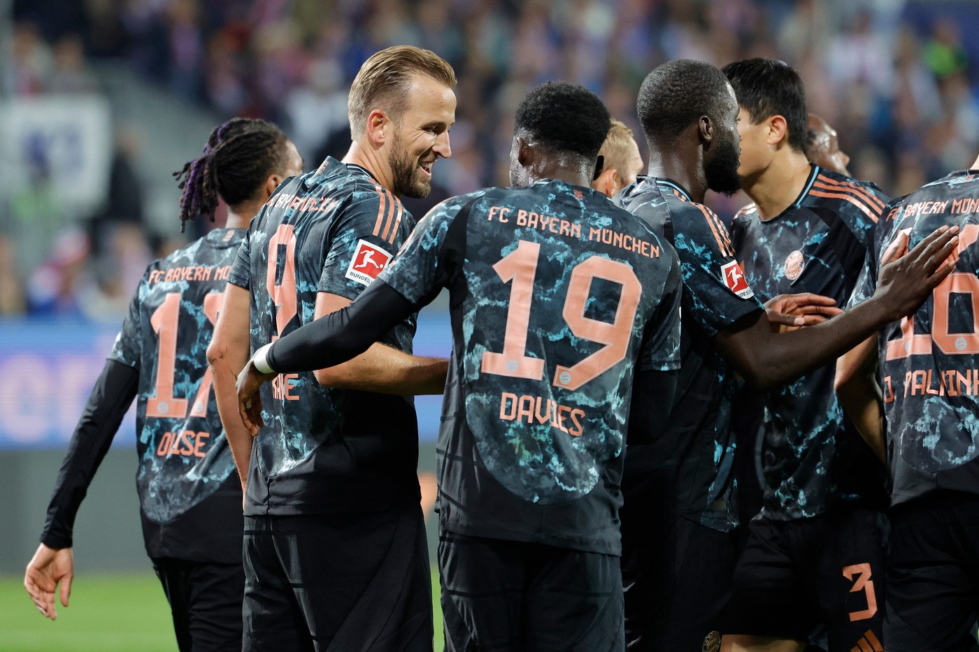 Bayern Munich's English forward #09 Harry Kane celebrates scoring from the penalty spot with his teammates during the German first division Bundesliga football match between Holstein Kiel and FC Bayern Munich in Kiel, northern Germany, on September 14, 2024.,Image: 907668255, License: Rights-managed, Restrictions: DFL REGULATIONS PROHIBIT ANY USE OF PHOTOGRAPHS AS IMAGE SEQUENCES AND/OR QUASI-VIDEO, Model Release: no, Credit line: AXEL HEIMKEN / AFP / Profimedia