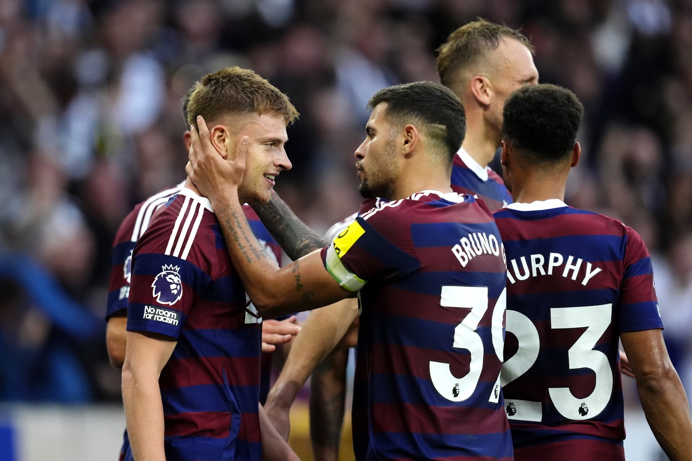 Newcastle United's Harvey Barnes (left) celebrates scoring his side's second goal of the game with team-mates during the Premier League match at Molineux Stadium, Wolverhampton. Picture date: Sunday September 15, 2024.,Image: 907963733, License: Rights-managed, Restrictions: EDITORIAL USE ONLY No use with unauthorised audio, video, data, fixture lists, club/league logos or "live" services. Online in-match use limited to 120 images, no video emulation. No use in betting, games or single club/league/player publications., Model Release: no, Credit line: Nick Potts / PA Images / Profimedia