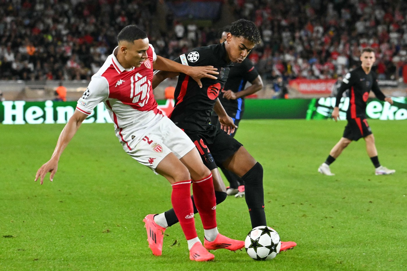 Monaco's Brazilian defender #02 Vanderson De Oliveira Campos (L) fights for the ball with Barcelona's Spanish forward #19 Lamine Yamal during the UEFA Champions League 1st round day 1 football match between AS Monaco and FC Barcelona at the Louis II Stadium in the Principality of Monaco on September 19, 2024.,Image: 909866739, License: Rights-managed, Restrictions: , Model Release: no, Credit line: Miguel MEDINA / AFP / Profimedia