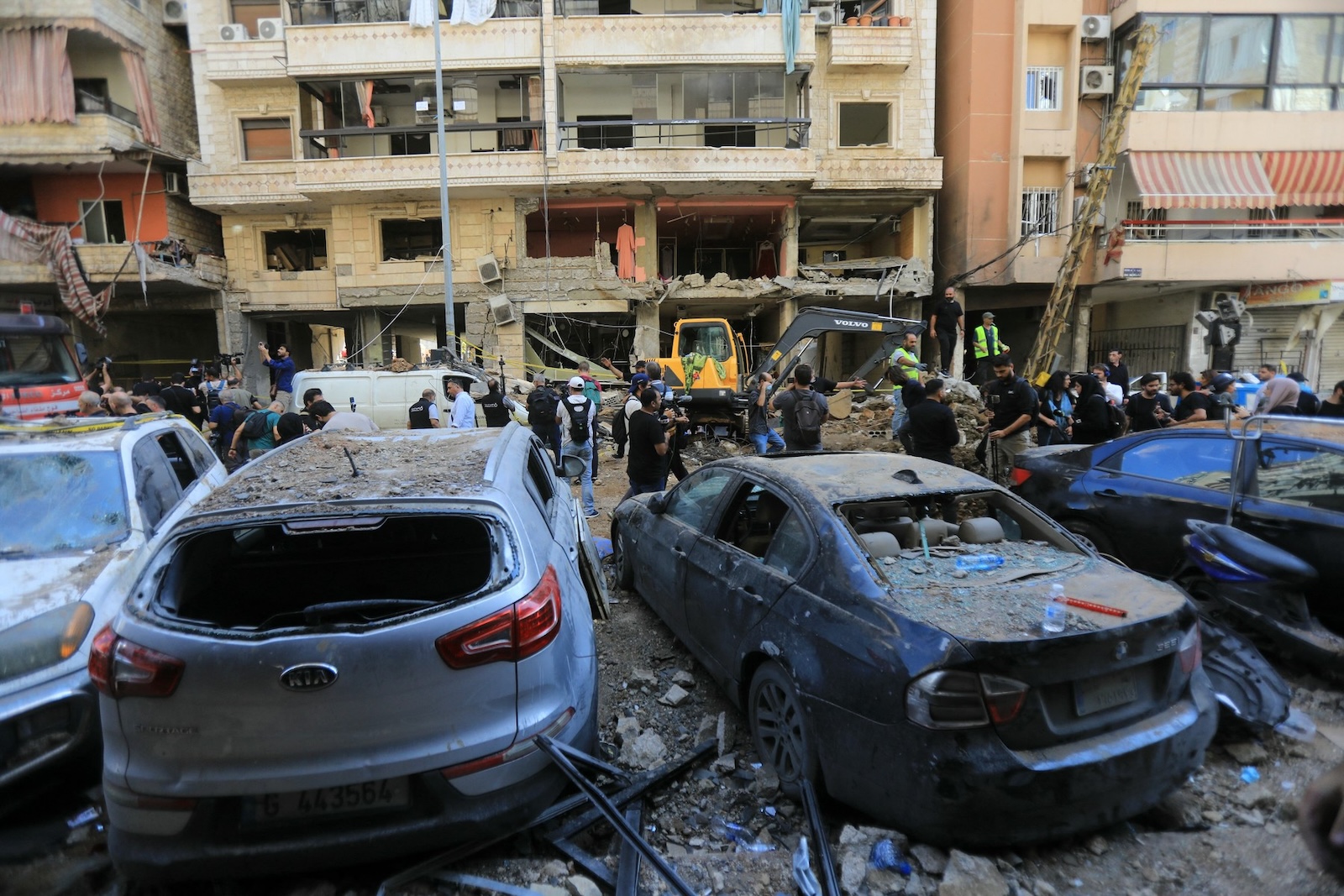 People gather at the scene of an Israeli strike that targeted Beirut's southern suburbs a day earlier, as search and rescue operations continue on September 21, 2024. Lebanon's Hezbollah said on September 21 that a second senior commander was among 16 fighters killed in an Israeli air strike on its Beirut stronghold the previous day, highlighting the scale of the blow to its military leadership.,Image: 910334949, License: Rights-managed, Restrictions: , Model Release: no, Credit line: AFP / AFP / Profimedia