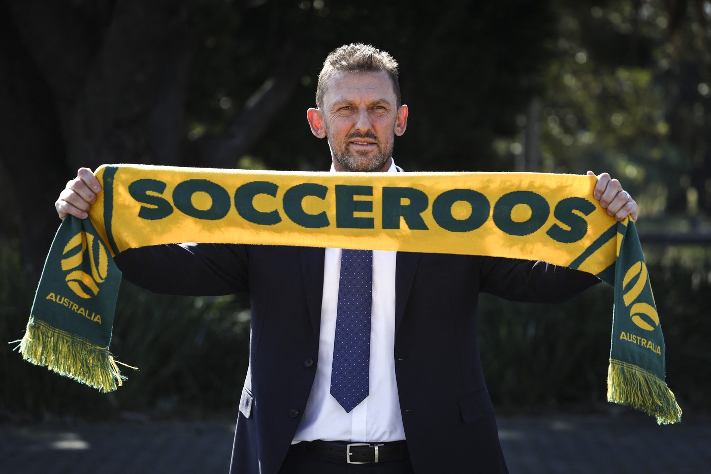 Tony Popovic, the newly-appointed head coach for Australia's national football team, poses with a scarf after a press conference in Sydney on September 23, 2024. Football Australia appointed former Crystal Palace defender Tony Popovic as the new Socceroos coach on September 23, tasking him with rescuing their faltering World Cup qualifying campaign.,Image: 910930579, License: Rights-managed, Restrictions: -- IMAGE RESTRICTED TO EDITORIAL USE - STRICTLY NO COMMERCIAL USE --, Model Release: no, Credit line: DAVID GRAY / AFP / Profimedia