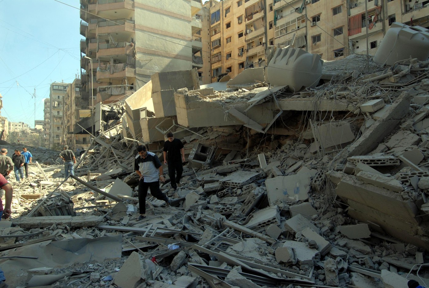 BEIRUT, LEBANON - (ARCHIVE): A file photo dates August 14, 2006 shows people looking at the heavily damaged buildings, parts of which have collapsed due to Israeli attacks that continued for 34 days in Dahiya district of Beirut, Lebanon on August 14, 2006. Eyup Coskun / Anadolu/ABACAPRESS.COM,Image: 912669847, License: Rights-managed, Restrictions: , Model Release: no, Credit line: AA/ABACA / Abaca Press / Profimedia