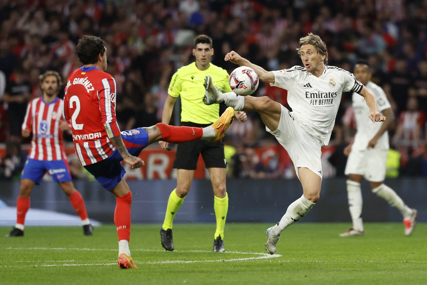 Real Madrid's Croatian midfielder #10 Luka Modric fights for the ball with Atletico Madrid's Uruguayan defender #02 Jose Gimenez during the Spanish league football match between Club Atletico de Madrid and Real Madrid CF at the Metropolitano stadium in Madrid on September 29, 2024.,Image: 913815885, License: Rights-managed, Restrictions: , Model Release: no, Credit line: OSCAR DEL POZO / AFP / Profimedia