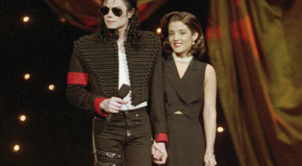 FILE - Michael Jackson and Lisa Marie Presley-Jackson acknowledge applause from the audience after coming out onstage to open the 11th annual MTV Video Music Awards at New York's Radio City Music Hall, Sept. 8, 1994. Presley, singer and only child of Elvis, died Thursday, Jan. 12, 2023, after a hospitalization, according to her mother, Priscilla Presley. She was 54. (AP Photo/Bebeto Matthews, File)