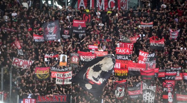 AC Milan's fans cheer before the Serie A soccer match between Roma and AC Milan, at Rome's Olympic stadium, Saturday, April 29, 2023. (AP Photo/Gregorio Borgia) Italy Soccer Serie A