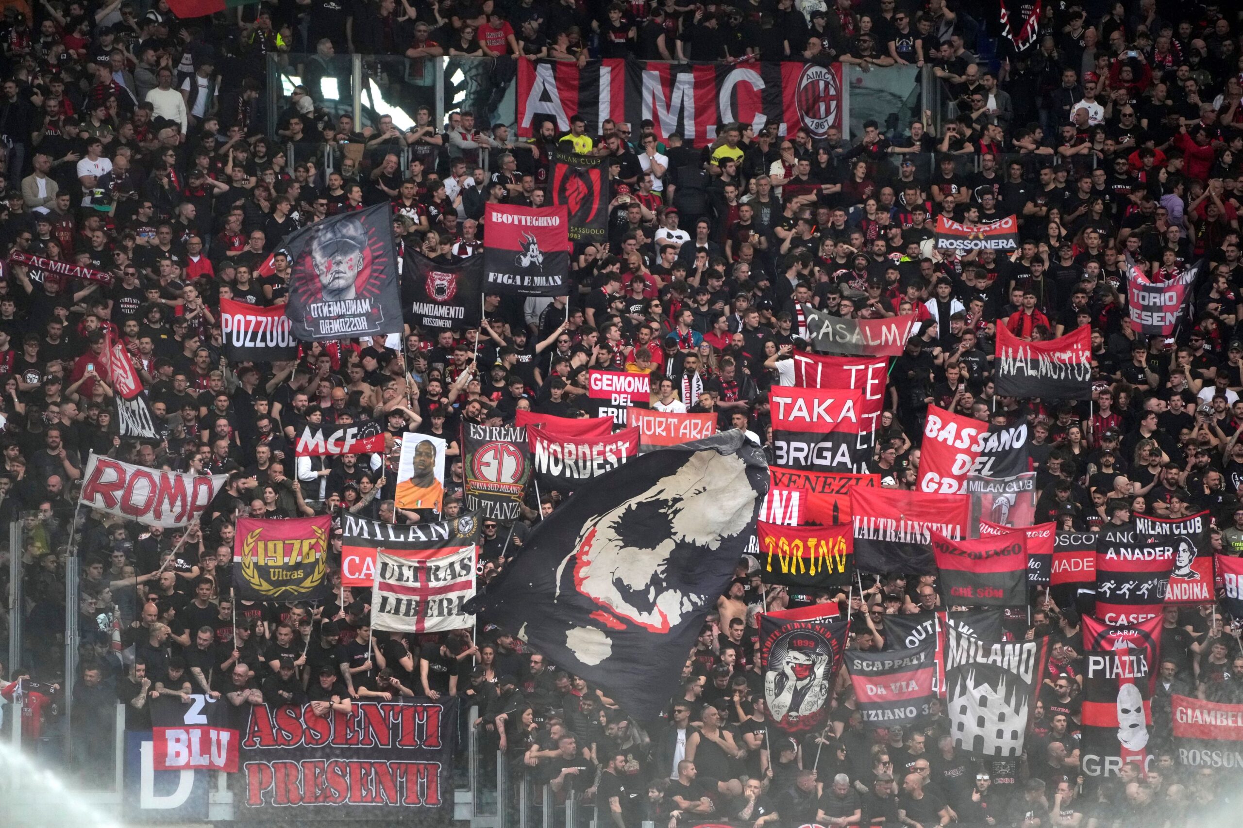 AC Milan's fans cheer before the Serie A soccer match between Roma and AC Milan, at Rome's Olympic stadium, Saturday, April 29, 2023. (AP Photo/Gregorio Borgia) Italy Soccer Serie A