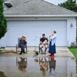 ALTAMONTE SPRINGS, FLORIDA, UNITED STATES - OCTOBER 10: Residents sit in their driveway on a street  that was flooded by rains from Hurricane Milton on October 10, 2024 in Altamonte Springs, Florida. Hurricane Milton passed through Central Florida after making landfall on Wednesday night on Floridaâ€™s Gulf coast as a Category 3 hurricane. The storm has caused massive destruction and flooding, spawned deadly tornadoes, and left millions without power. Paul Hennessy / Anadolu,Image: 919418748, License: Rights-managed, Restrictions: , Model Release: no, Credit line: Paul Hennessy / AFP / Profimedia