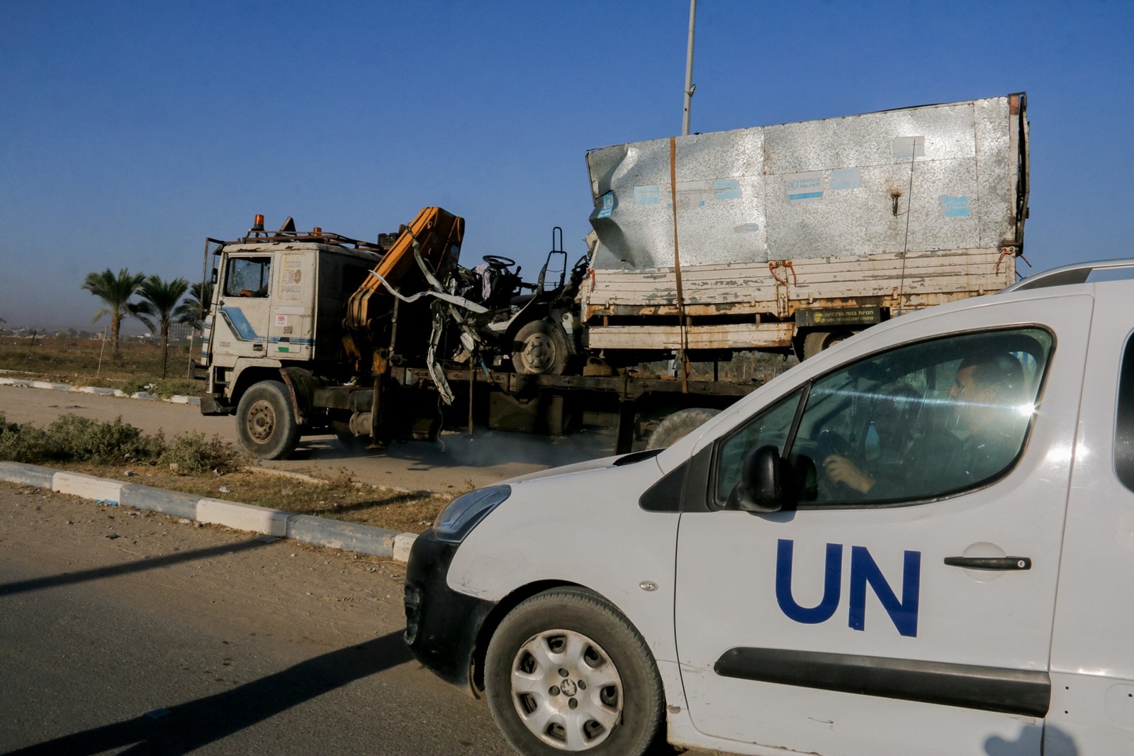 A United Nations (UN) vehicle near a destroyed van, with UN Relief and Works Agency (UNRWA) markings, following an Israeli strike on Salah al-Din Street south of Deir al-Balah, central Gaza, on Wednesday, October 23, 2024. Hospitals and shelters for Palestinians seeking refuge have come under siege in northern Gaza as Israeli forces intensified their attacks on Hamas. Medical supplies are running desperately low. The UN Palestinian refugee agency UNRWA has accused Israel of preventing supplies of food and medicine from reaching areas in the north of Gaza.,Image: 925755915, License: Rights-managed, Restrictions: , Model Release: no, Credit line: Middle East Images/ABACA / Abaca Press / Profimedia