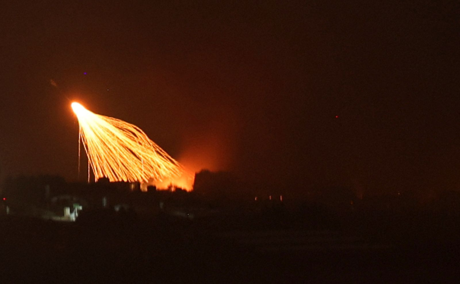 epa11634326 Israeli artillery shells hit areas near villages in southern Lebanon along the border with Israel, as seen from the Upper Galilee, northern Israel, 30 September 2024. Israel's military stated that it has been 'strengthening defense' along the contact line in the country's northern border as it was preparing for the 'next phases of combat'. The Israel Defense Forces (IDF) said they 'will continue to strike, harm, and degrade' Hezbollah's military in Lebanon.  EPA/ATEF SAFADI