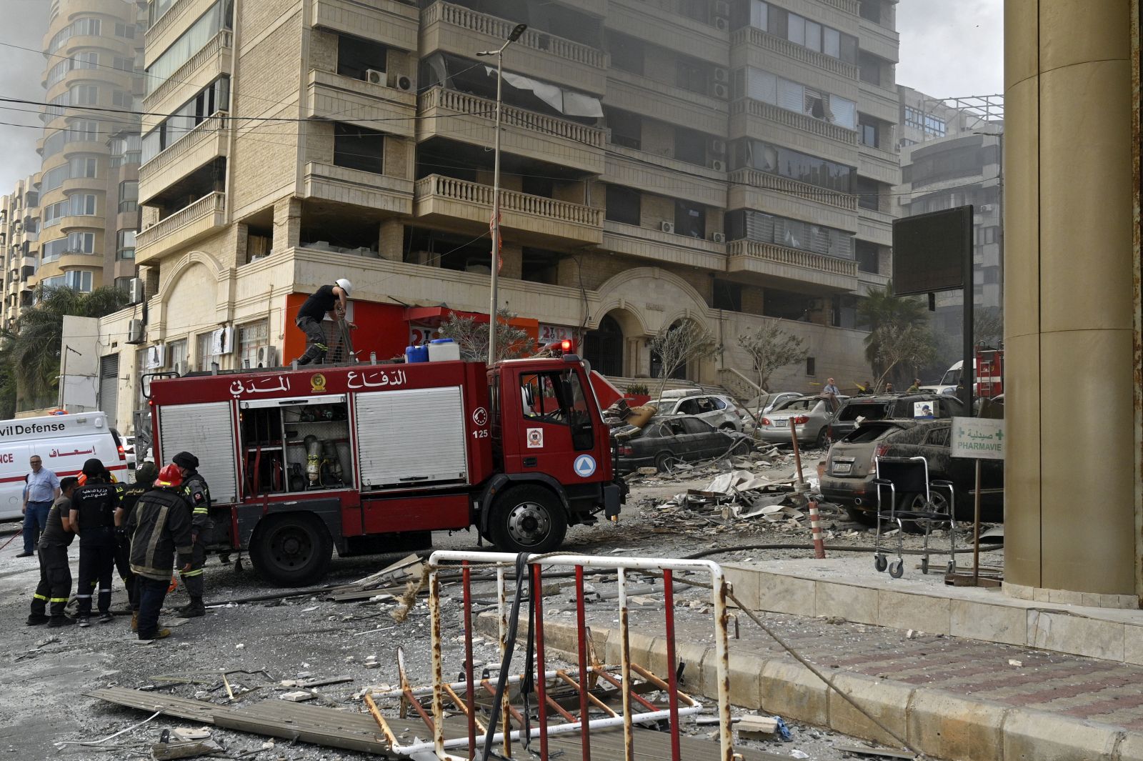 epa11635907 Civil defense members work at the site following an Israeli military strike, in Beirut, Lebanon, 01 October 2024. According to the Lebanese National News Agency (NNA), Israel targeted two areas in the southern suburbs of Beirut. The Israeli army (Tsahal) said it conducted 'a precise strike' on Beirut on 01 October.  EPA/WAEL HAMZEH