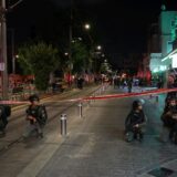 epa11636266 Armed Israeli police officers keep watch near a cordon at the site of a shooting incident in Tel Aviv, Israel, 01 October 2024. According to Israeli police, at least eight people were killed and nine others wounded in a shooting incident on Sderot Yerushalim in Tel Aviv. Two gunmen have been 'neutralized' on site, police said.  EPA/ABIR SULTAN