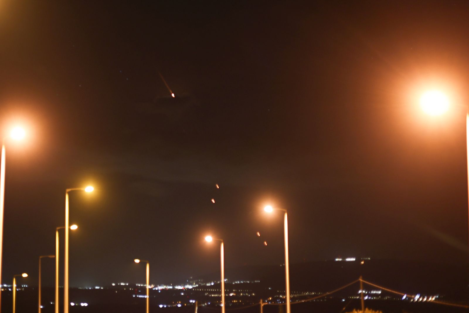 epa11636240 Projectiles fly over the Upper Galilee, northern Israel, 01 October 2024. Israel's military stated that Iran has launched missiles towards the State of Israel on 01 October, and asked citizens to 'remain vigilant' and to follow the Home Front Command's instructions directing people to protected areas and remain there 'until further instructions' are given.  EPA/ATEF SAFADI