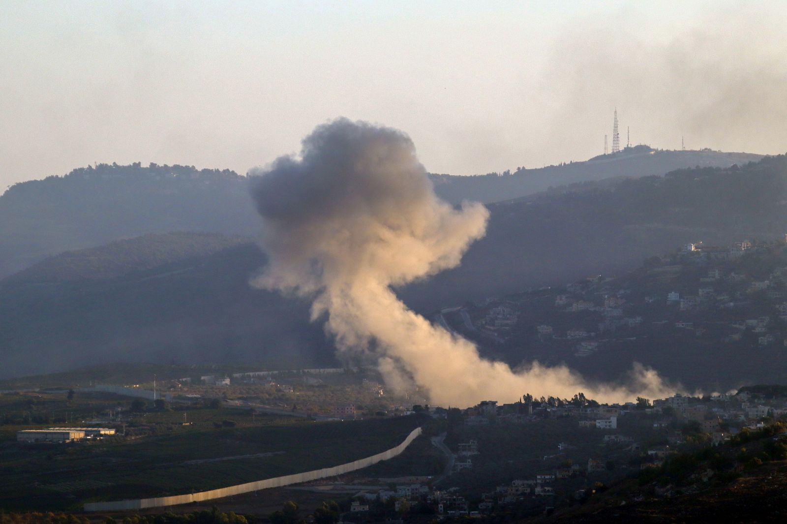 epa11638134 Smoke rises following an Israeli military strike, in Kafr Kila village, southern Lebanon, 02 October 2024. According to the Lebanese National News Agency (NNA), Israeli warplanes conducted a series of raids against multiple neighborhoods in the southern suburbs of Beirut (Dahieh) on the evening of 01 October. On 30 September Israel announced the beginning of a 'limited, localized and targeted' ground operation against Hezbollah in southern Lebanon.  EPA/STR