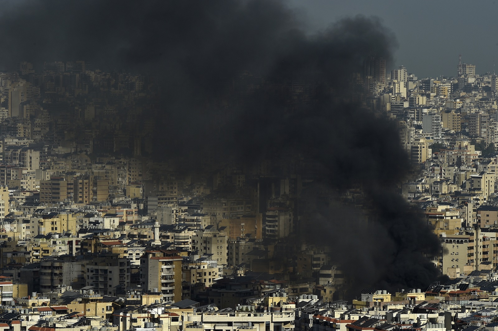 epa11639243 Smoke rises following an Israeli airstrike in Dahieh, a southern suburb controlled by Hezbollah in Beirut, Lebanon, 03 October 2024. The Lebanese National News Agency (NNA) said that Israeli airstrikes were carried out overnight in the southern suburb, along with shelling from warships at sea.  EPA/WAEL HAMZEH