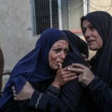 epa11644974 A group of relatives mourns during the funeral of Palestinians killed in an Israeli airstrike, in Deir Al Balah, central Gaza Strip, 06 October 2024. According to the Palestinian Ministry of Health in Gaza, at least 18 Palestinians were killed in an Israeli airstrike in Deir Al Balah on 06 October. More than 41,800 Palestinians and over 1,400 Israelis have been killed, according to the Palestinian Health Ministry and the Israel Defense Forces (IDF), since Hamas militants launched an attack against Israel from the Gaza Strip on 07 October 2023, and the Israeli operations in Gaza and the West Bank which followed it.  EPA/MOHAMMED SABER