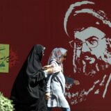 epa11647109 Iranian women walk past a portrait of late Hezbollah leader Hassan Nasrallah displayed in a street in Tehran, Iran, 07 October 2024. Tensions are growing between Iran and Israel following Iran's large-scale missile attack on Israel. Iran fired more than 180 ballistic missiles directed at Israel late on 01 October 2024, in 'retaliation for different assassinations' carried out by Israel and 'the crimes in Palestine and Lebanon', Islamic Revolutionary Guard Corps (IRGC) said. Israel's prime minister Benjamin Netanyahu said that Iran will pay for the 'big mistake'.  EPA/ABEDIN TAHERKENAREH