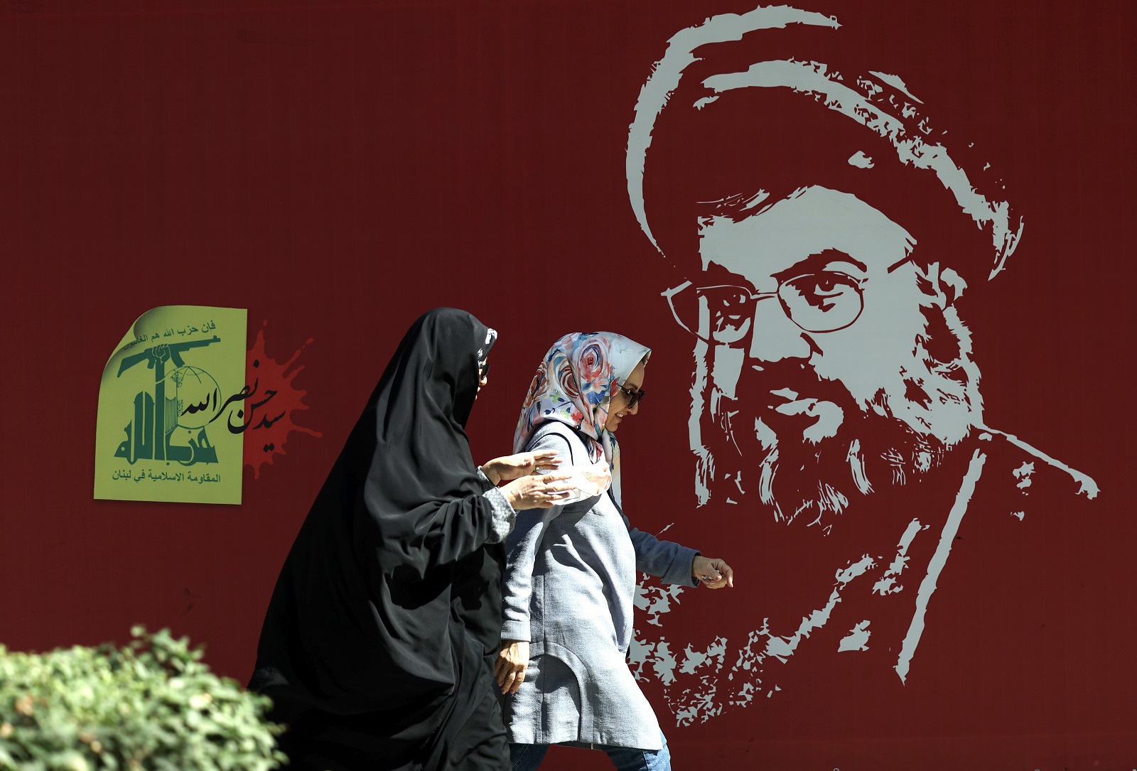 epa11647109 Iranian women walk past a portrait of late Hezbollah leader Hassan Nasrallah displayed in a street in Tehran, Iran, 07 October 2024. Tensions are growing between Iran and Israel following Iran's large-scale missile attack on Israel. Iran fired more than 180 ballistic missiles directed at Israel late on 01 October 2024, in 'retaliation for different assassinations' carried out by Israel and 'the crimes in Palestine and Lebanon', Islamic Revolutionary Guard Corps (IRGC) said. Israel's prime minister Benjamin Netanyahu said that Iran will pay for the 'big mistake'.  EPA/ABEDIN TAHERKENAREH