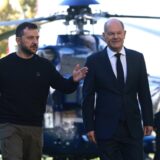 epa11654642 German Chancellor Olaf Scholz (R) and Ukrainian President Volodymyr Zelensky (L) walk in front of a helicopter at the chancellery in Berlin, Germany, 11 October 2024. Zelensky is on a visit to Germany after visiting France and Italy.  EPA/CLEMENS BILAN