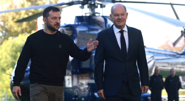 epa11654642 German Chancellor Olaf Scholz (R) and Ukrainian President Volodymyr Zelensky (L) walk in front of a helicopter at the chancellery in Berlin, Germany, 11 October 2024. Zelensky is on a visit to Germany after visiting France and Italy.  EPA/CLEMENS BILAN