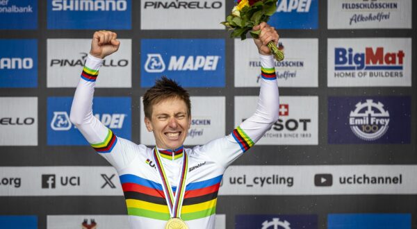 epa11632541 Gold medalist Tadej Pogacar of Slovenia poses on the podium for the Men Elite Road Race at the 2024 UCI Road and Para-cycling Road World Championships in Zurich, Switzerland, 29 September 2024.  EPA/MICHAEL BUHOLZER