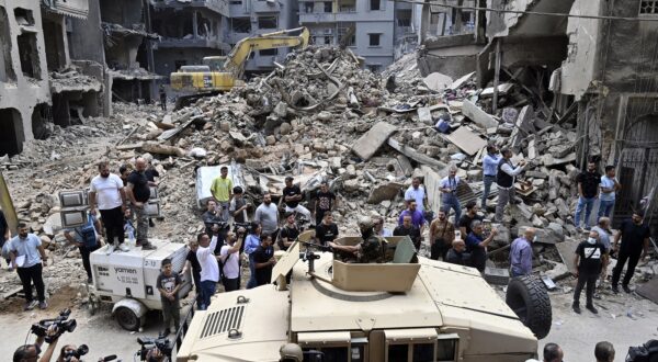 epa11655795 A Lebanese army vehicle drives as security personnel and members of the media wait for the arrival of the Speaker of the Parliament of Iran in the Basta neighborhood that was hit by an Israeli military strike in Beirut, Lebanon, 12 October 2024. At least 22 people were killed and 117 injured in an Israeli military strike in Beirut, Lebanon's Ministry of Public Health stated on 10 October. According to the Lebanese Ministry of Health, more than 2,100 people have been killed and over 10,000 others have been injured in Lebanon since Israel expanded its military operations to Lebanon in September 2024.  EPA/WAEL HAMZEH