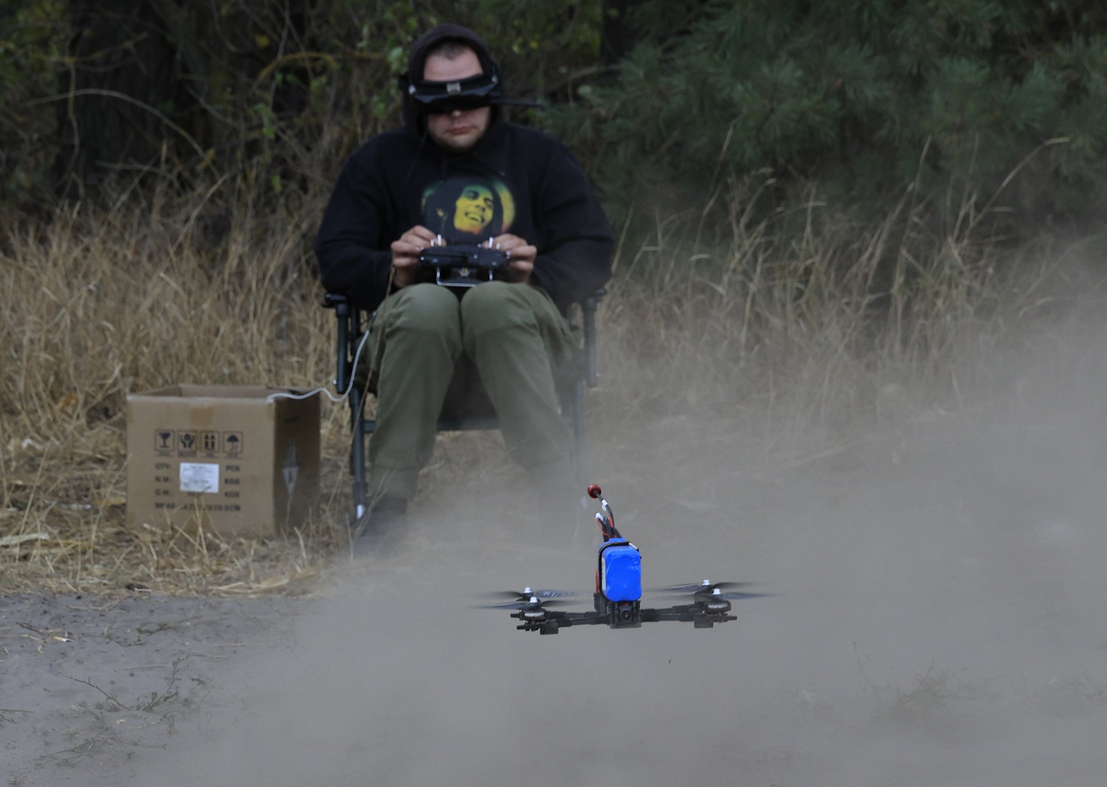 epa11656915 A picture made available on 13 October 2024 shows Ukrainian servicemen testing FPV drones at an undisclosed location near the frontline in the Kharkiv region, 12 October 2024 amid the ongoing Russian invasion. Servicemen of the special unit of the 57th Mechanized Brigade are engaged in the assembly, debugging, and field testing of FPV drones before equipping them with explosives and sending them on a combat flight. Russian troops entered Ukrainian territory on 24 February 2022, starting a conflict that has provoked destruction and a humanitarian crisis.  EPA/SERGEY KOZLOV 65332