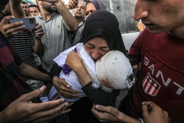 epaselect epa11658001 A Palestinian woman, grandmother of killed one-and-a-half-year old baby Yaman Al Zaneen, mourns while carrying his body during the funeral in Deir al Balah, central Gaza Strip, 14 October 2024. According to the Palestinian Ministry of Health, 23 people, including children, were killed after a school sheltering internally displaced Palestinians in Nuseirat camp was struck by an Israeli attack on 13 October. More than 42,200 Palestinians and over 1,400 Israelis have been killed, according to the Palestinian Health Ministry and the Israeli Army, Tsahal, since Hamas militants launched an attack against Israel from the Gaza Strip on 07 October 2023, and the Israeli operations in Gaza and the West Bank which followed it.  EPA/MOHAMMED SABER