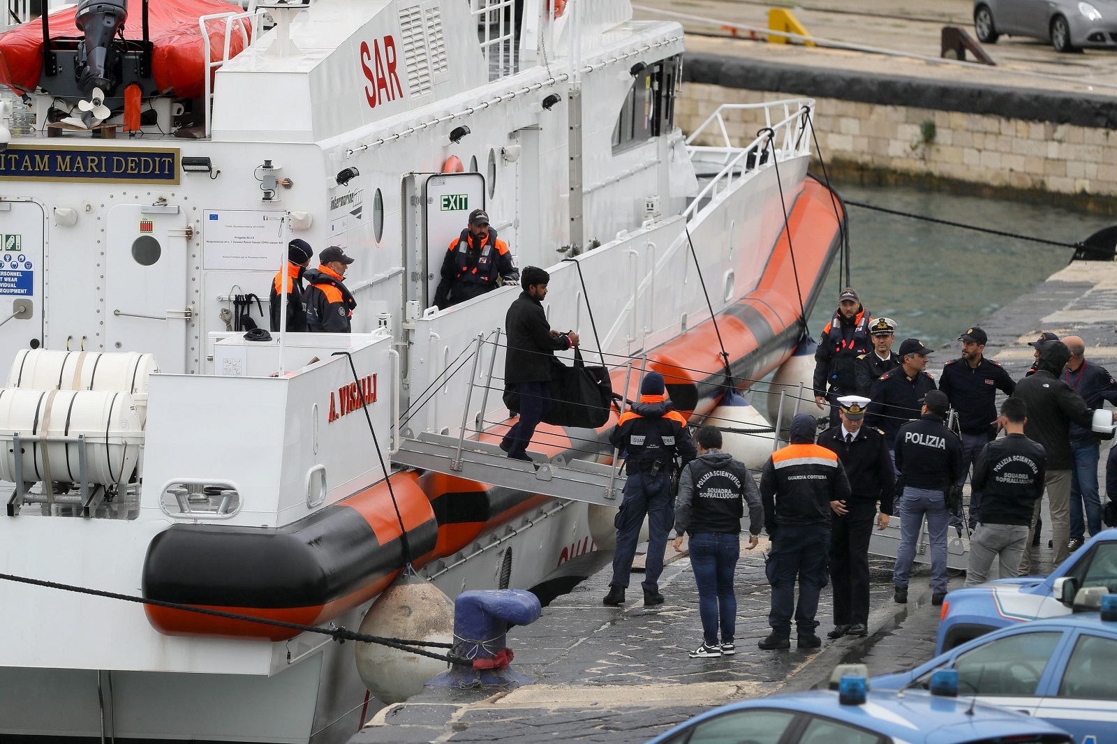 epa11668878 The Italian coast guard patrol boat arrives at the port of Bari carrying the 12 migrants from the Italian repatriation center in Gjader, for whom the return to Italy was ordered after the Rome court, in Bari, Italy, 19 October 2024. The immigration section of the Rome Court has ruled against the detention of migrants at the Italian repatriation center in Gjader, Albania, which was established under the Italy-Albania migration management agreement. The patrol boat left from Albania around 9.30am on 19 October.  EPA/DONATO FASANO