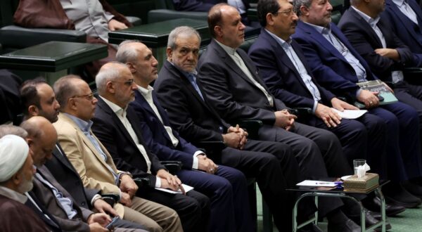 epa11674214 Iranian president Masoud Pezeshkian (C) attends the parliament session in Tehran, Iran, 22 October 2024. Iranian President Masoud Pezeshkian presented a draft state budget to the parliament for the coming Persian year 1404 that will start on 21 March 2025.  EPA/ABEDIN TAHERKENAREH