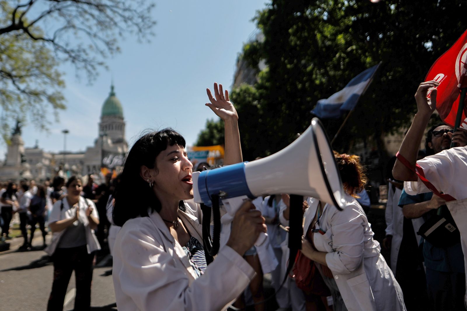 epa11676399 Health workers participate in a march towards the Casa Rosada (headquarters of the Executive), in Buenos Aires, Argentina, 22 October 2024. Health personnel joined university professors and students to lead a "white march" in protest against the adjustment of the Javier Milei Government to public health and education. Doctors and nurses wearing white coats as well as teachers and students, converged on the Plaza de Mayo to protest against insufficient funds for the operation of public hospitals and universities, low salaries and layoffs in the health sector.  EPA/JUAN IGNACIO RONCORONI