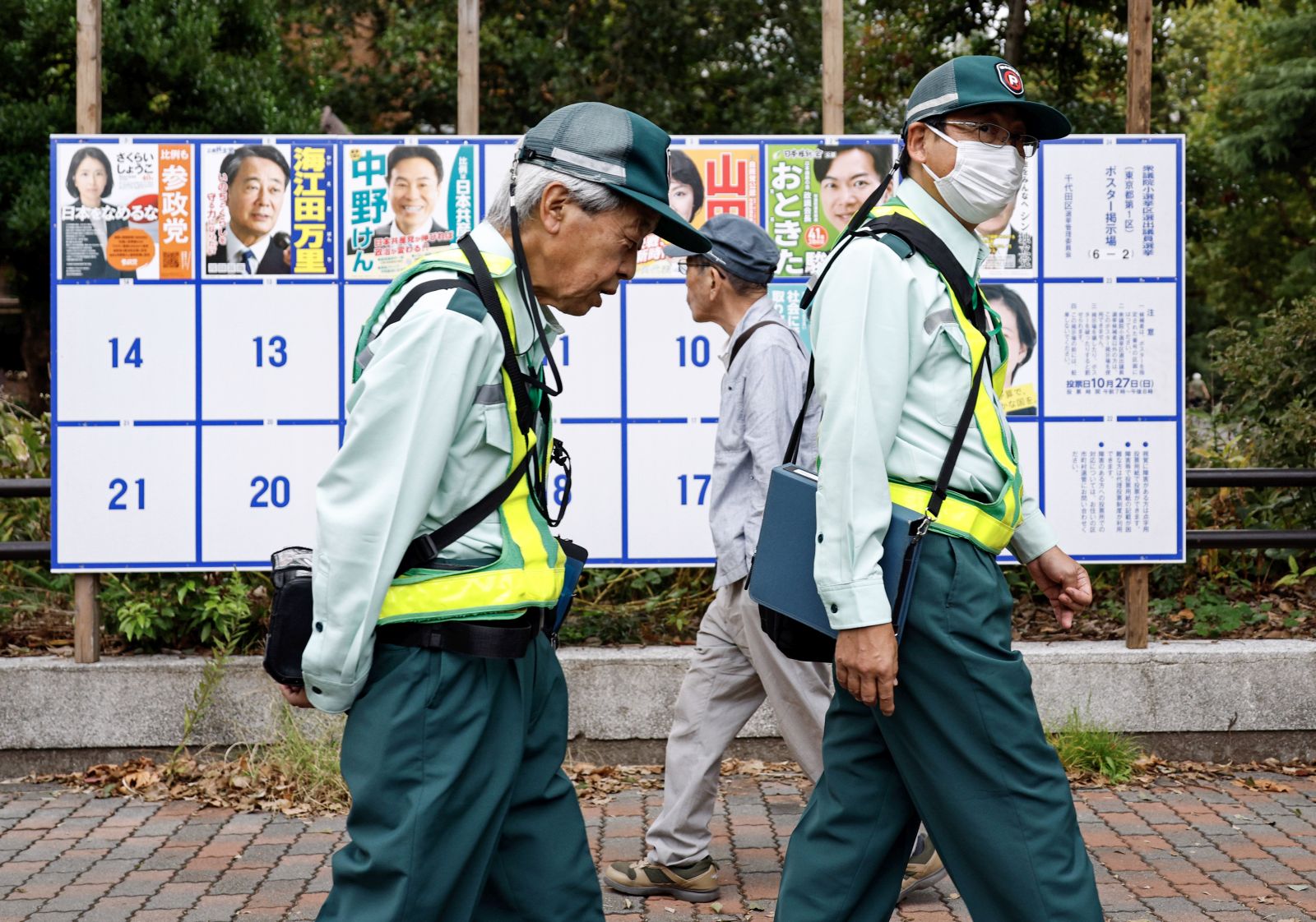 epa11682176 People pass by a board displaying campaign posters of candidates running for the upcoming general elections in Tokyo, Japan, 25 October 2024. Shortly after being elected as Japan’s Prime Minister, Ishiba Shigeru dissolved the parliament and called for elections of the House of Representatives, the lower house of Japan's National Diet. Set for 27 October, the vote will follow a 12-day campaign amid scandals involving the ruling Liberal Democratic Party (LDP), a sluggish economy and rising consumer prices, according to the European Parliament Think Tank.  EPA/FRANCK ROBICHON