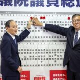 epa11687005 Japan's Prime Minister Shigeru Ishiba (R) and Yoshihide Suga, Vice President of Japan's Liberal Democratic Party (LDP), place a pin on a board showing candidate's names while speaking to the media at the LDP's headquarters, Tokyo, Japan, 27 October 2024. Exit polling suggested that the incumbent LDP would not be able to form a single-party majority government in a snap election called by Prime Minister Shigeru Ishiba.  EPA/TAKASHI AOYAMA / POOL