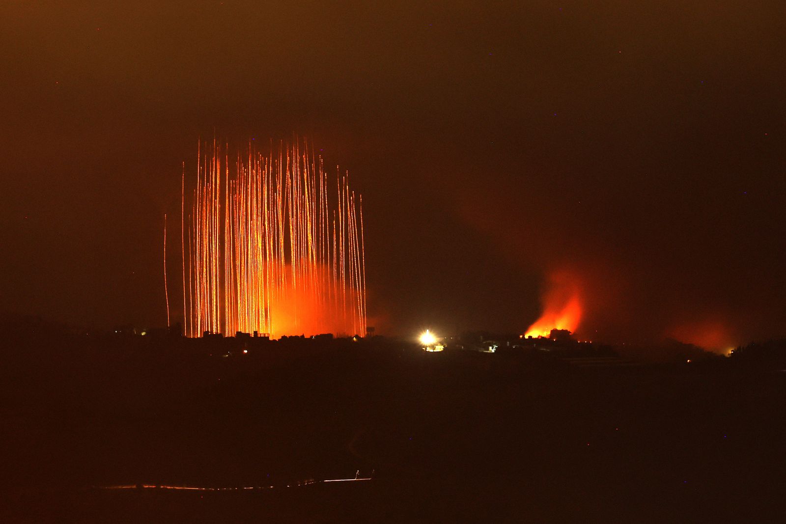 epaselect epa11634324 Israeli artillery shells hit areas near villages in southern Lebanon along the border with Israel, as seen from the Upper Galilee, northern Israel, 30 September 2024. Israel's military stated that it has been 'strengthening defense' along the contact line in the country's northern border as it was preparing for the 'next phases of combat'. The Israel Defense Forces (IDF) said they 'will continue to strike, harm, and degrade' Hezbollah's military in Lebanon.  EPA/ATEF SAFADI