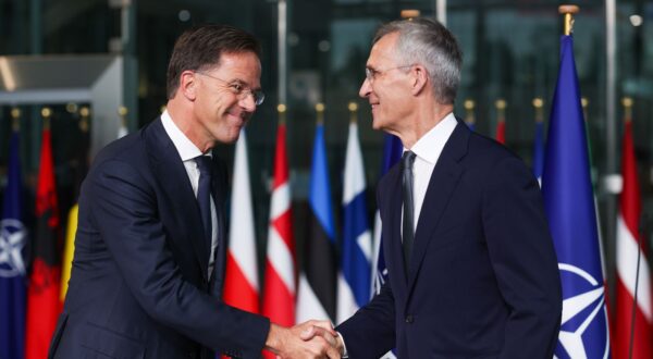 epa11634721 Former Dutch Prime Minister Mark Rutte (L) and Jens Stoltenberg shake hands on the day Rutte succeeds Stoltenberg as NATO Secretary General, at the Alliance headquarters in Brussels, Belgium, 01 October 2024. Former Dutch Prime Minister Mark Rutte succeeds Jens Stoltenberg as Secretary General of the North Atlantic Treaty Organization (NATO) on 01 October 2024 after the latter's ten years at the helm of the Alliance.  EPA/OLIVIER HOSLET