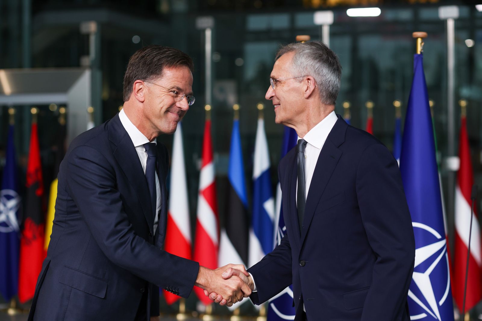 epa11634721 Former Dutch Prime Minister Mark Rutte (L) and Jens Stoltenberg shake hands on the day Rutte succeeds Stoltenberg as NATO Secretary General, at the Alliance headquarters in Brussels, Belgium, 01 October 2024. Former Dutch Prime Minister Mark Rutte succeeds Jens Stoltenberg as Secretary General of the North Atlantic Treaty Organization (NATO) on 01 October 2024 after the latter's ten years at the helm of the Alliance.  EPA/OLIVIER HOSLET