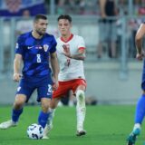 08.09.2024., Opus Arena, Osijek - UEFA Liga nacija, Liga A, skupina 1, 2. kolo, Hrvatska - Poljska. Mateo Kovacic, Kacper Urbanski. Photo: Davor Javorovic/PIXSELL