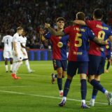 Soccer Football - Champions League - FC Barcelona v BSC Young Boys - Estadi Olimpic Lluis Companys, Barcelona, Spain - October 1, 2024 FC Barcelona's Robert Lewandowski celebrates scoring their fourth goal with Inigo Martinez and Pau Cubarsi REUTERS/Albert Gea Photo: ALBERT GEA/REUTERS