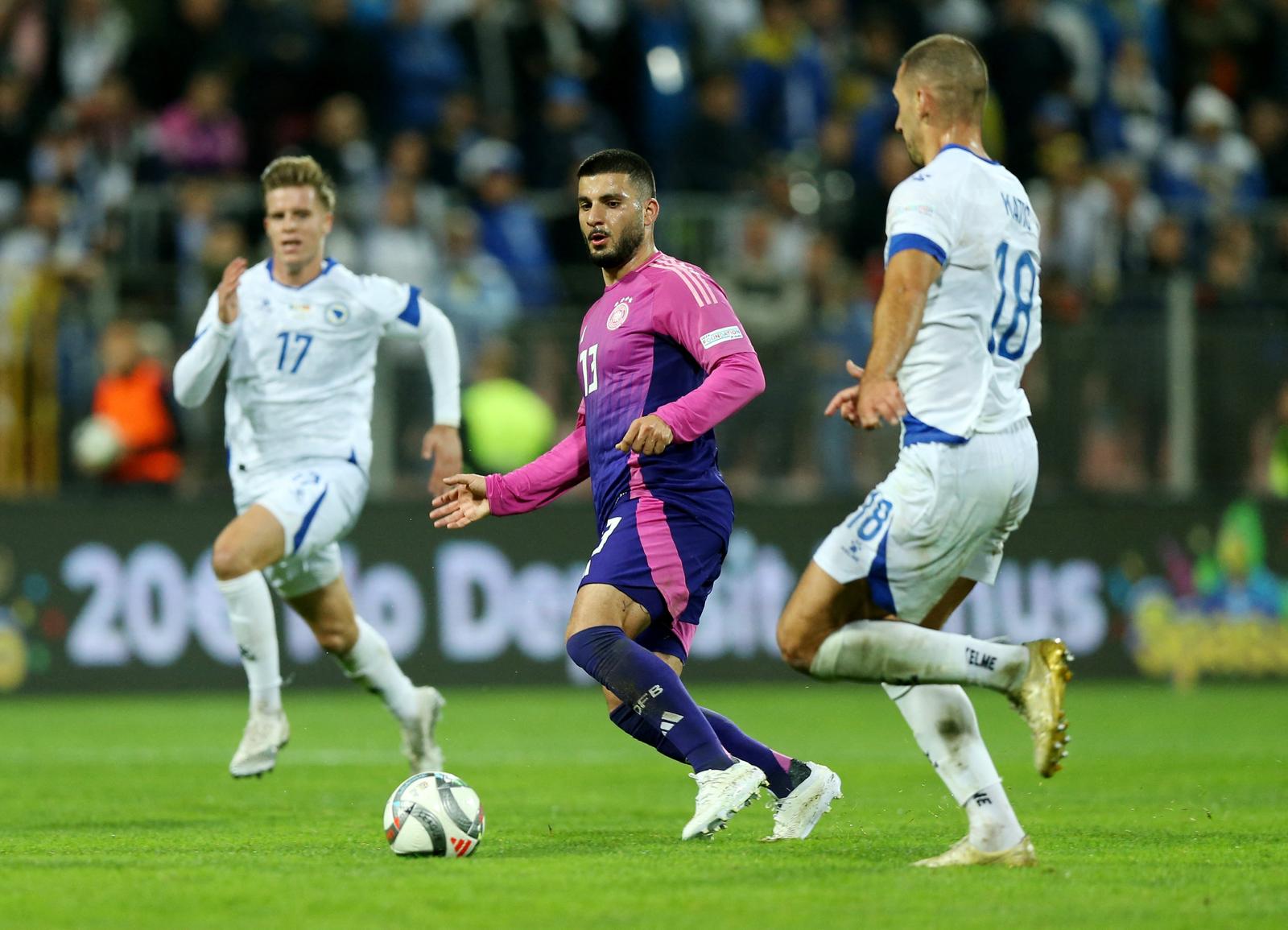 Soccer Football - UEFA Nations League - Group A3 - Bosnia and Herzegovina v Germany - Bilino Polje Stadium, Zenica, Bosnia and Herzegovina - October 11, 2024 Germany's Deniz Undav in action with Bosnia and Herzegovina's Nikola Katic REUTERS/Amel Emric Photo: AMEL EMRIC/REUTERS