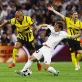 Soccer Football - Champions League - Real Madrid v Borussia Dortmund - Santiago Bernabeu, Madrid, Spain - October 22, 2024 Borussia Dortmund's Donyell Malen in action with Real Madrid's Luka Modric REUTERS/Susana Vera Photo: SUSANA VERA/REUTERS