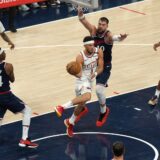 Oct 23, 2024; Inglewood, California, USA; Phoenix Suns guard Devin Booker (1) is defended by LA Clippers center Ivica Zubac (40) in the first half  at Intuit Dome. Mandatory Credit: Kirby Lee-Imagn Images Photo: Kirby Lee/REUTERS