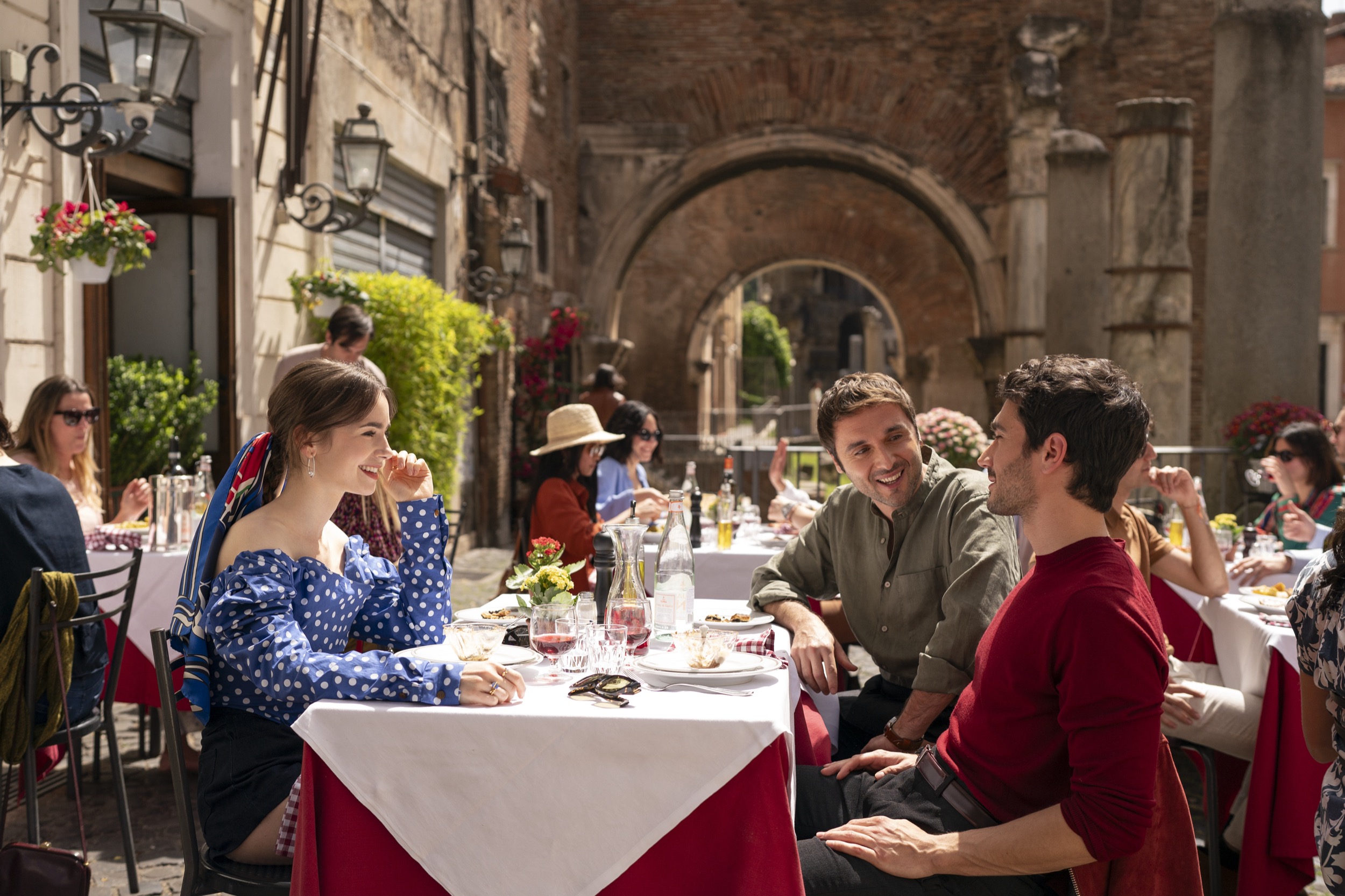 Emily in Paris. (L to R) Lily Collins as Emily, Flavio Furno as Gianni, Eugenio Franceschini as Marcello in episode 409 of Emily in Paris. Cr. Giulia Parmigiani/Netflix © 2024