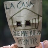 October 13, 2024, Madrid, Madrid, Spain: A woman with a paper bag over her face, which reads in Spanish ''The house I can afford'' during a protest to demand lower rental prices and better rental conditions, which took place in the streets of Madrid.,Image: 920492563, License: Rights-managed, Restrictions: , Model Release: no, Credit line: Luis Soto / Zuma Press / Profimedia