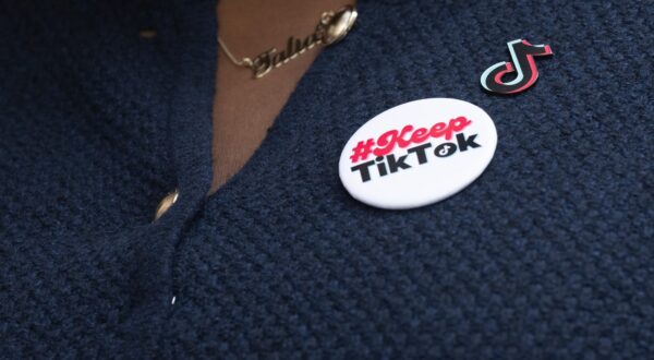 Talia Cadet, a TikTok content creator who sued the US Department of Justice over the TikTok ban, wears a button as she speaks to the media outside the E. Barrett Prettyman US Court House in Washington, DC, September 16, 2024, following oral arguments before an Appeals Court on a potential ban on TikTok in the US. TikTok will attempt to convince a federal court on Monday that a law requiring the video-sharing app to divest from its Chinese ownership or face a ban in the United States is unconstitutional. The fate of Americans' access to TikTok has become a prominent issue in the country's political debate, with Republican presidential candidate Donald Trump opposing any ban of the wildly popular app.,Image: 908437570, License: Rights-managed, Restrictions: , Model Release: no, Credit line: SAUL LOEB / AFP / Profimedia