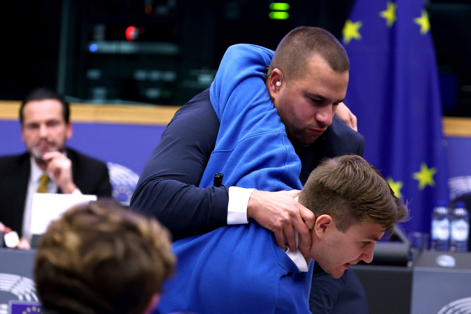 Security officers intercept a man disrupting the press conference of Hungary's Prime Minister Viktor Orban, on the sidelines of a plenary session at the European Parliament in Strasbourg, eastern France, on October 8, 2024. Hungary has followed the Netherlands in seeking an opt-out from EU rules on asylum, a minister has said, as the country's nationalist leader Viktor Orban headed to European Parliament on October 8.,Image: 918182382, License: Rights-managed, Restrictions: , Model Release: no, Credit line: FREDERICK FLORIN / AFP / Profimedia